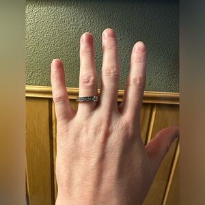 “Sterling silver moissanite” single band ring